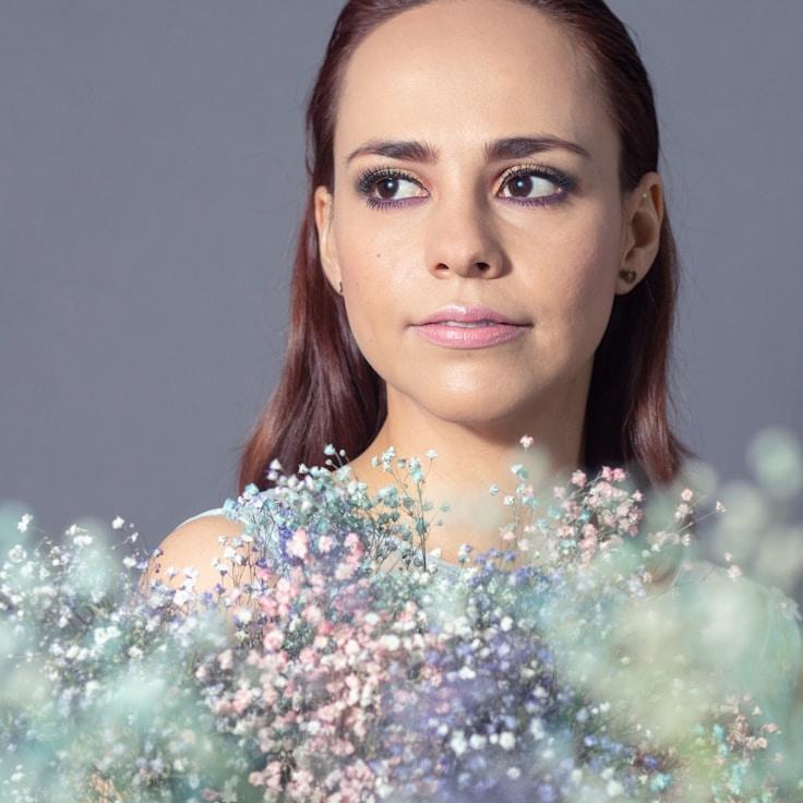 Kaveri Mehta, Lead Design Curator at Blue Peak Network, reviewing corporate floral arrangements